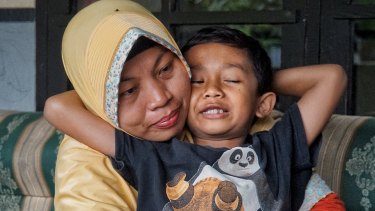 Baiq Nuril Maknun and her youngest son, seven-year-old Rafi.