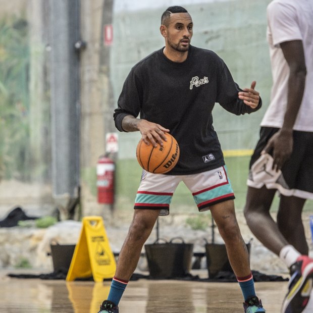 Australian tennis player Nick Kyrgios playing basketball with friends in The Rocks.