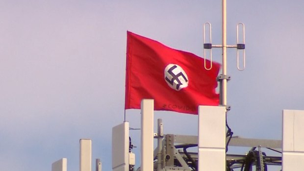 A large swastika has been planted on the top of a phone tower at Kyabram. There are also two Chinese flags. 