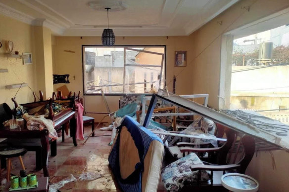 Upturned furniture and windows blown off the Sabawi family home.