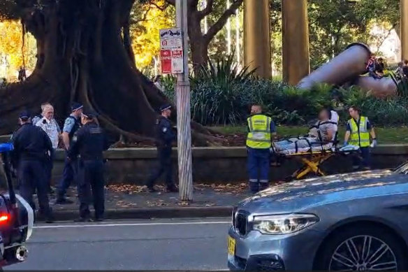 A police officer suffered stab wounds to the head in the attack next to Hyde Park in Sydney’s CBD.