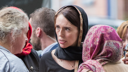 New Zealand Prime Minister Jacinda Ardern with members of Christchurch's Muslim community the day after the mosque attacks.