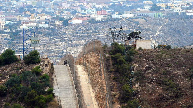 The border fence dividing the Spanish enclave of Melilla, left, from Morocco.