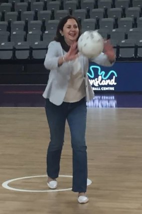 Queensland Premier Annastacia Palaszczuk fires the first centre pass at Queensland's new State Netball Centre at Mount Gravatt.