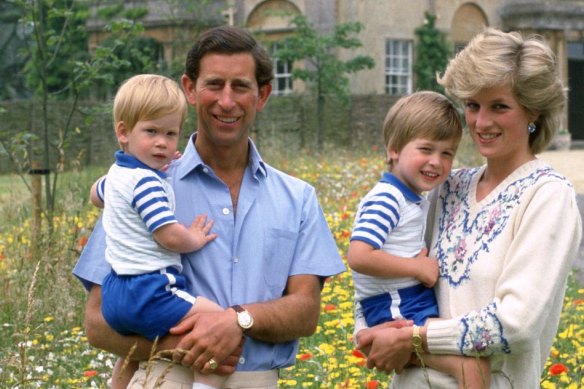 Charles with Harry, and Diana with William at Highgrove, England, in 1986.