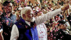 Prime Minister Narendra Modi is greeted by supporters as he arrives at his party’s headquarters in New Delhi.