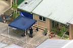 Police at the scene in Woodridge on Tuesday.