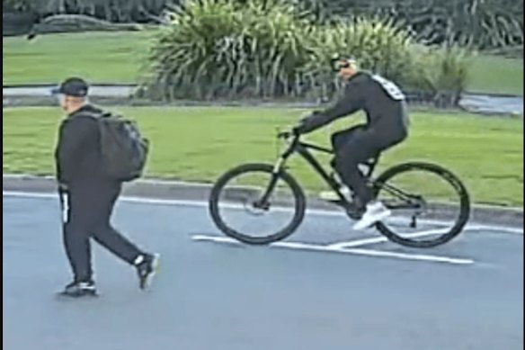 Police are asking for two men pictured together in Redcliffe on July 3 to come forward to help in their investigation into an incident where a man performed an indecent act at a family event.