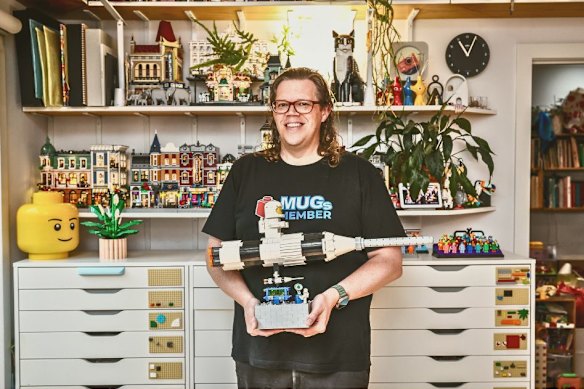 Jim Yencken in his meticulously organised Lego workshop, where thousands of pieces are stored in colour-coded drawers.