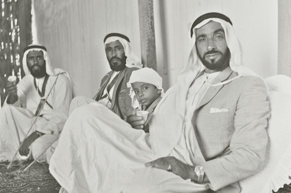 Members of the ruling Al Nahyan family drink tea in their palace just outside the city of Abu Dhabi in 1965, with ruler-to-be Sheikh Zayed bin Sultan Al Nahyan at front.
