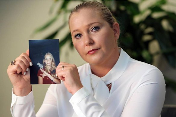 Virginia Giuffre in 2022, with a photo of herself as a teenager.