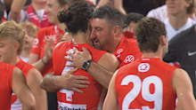 Dean Cox and Brodie Grundy embrace after the win.