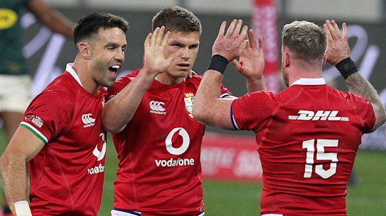 Conor Murray, Owen Farrell and Stuart Hogg celebrate.