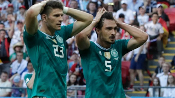 Going home: Mario Gomez, left, and Mats Hummels react to a missed chance.