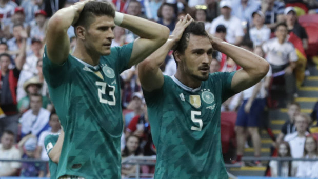 Going home: Mario Gomez, left, and Mats Hummels react to a missed chance.