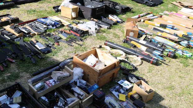 Police have found a massive arsenal of rifles, pistols, cross-bows, knives, swords and more than 2000 rounds of ammunition at a home in Richmond.