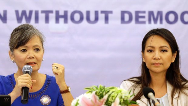 Vice President of the Cambodia National Rescue Party (CNRP), Mu Sochua, left, speaks at a press conference with Monovithya Kem, CNRP Deputy Director for Foreign Affairs, in Jakarta, Indonesia. Monday, July 30, 2018. The two exiled opposition politicians condemned Cambodia's election on Sunday as a sham. (AP Photo/Tatan Syuflana)