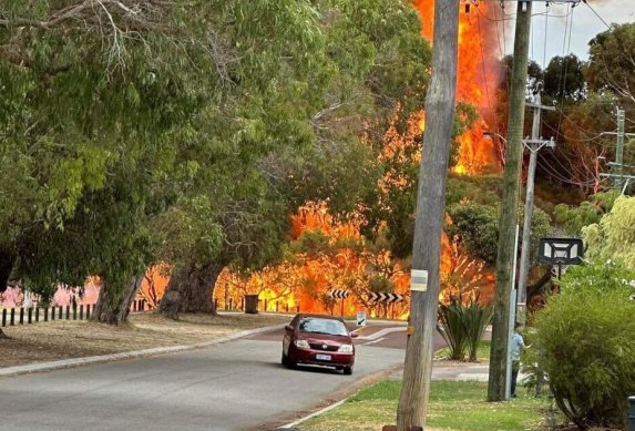 The fire came very close to homes.