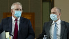 The Prime Minister and Treasurer leave the House of Representatives after question time, August 27.