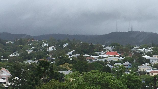 Rain clouds loom over Mt Coot-tha in Brisbane ahead of Sunday afternoon's expected dumping. 