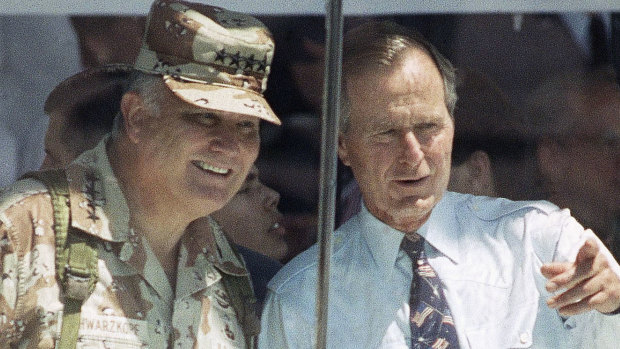 General Norman Schwarzkopf and President George Bush watch the National Victory Parade in Washington, 1991.