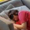 Ryan Millar takes a nap at work.