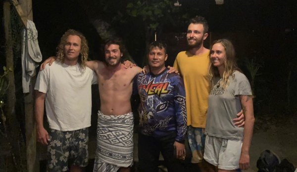 Australians Jordan Short, Will Teagle, Elliot Foote and Steph Weisse with Yustinus Sega (centre), the Indonesian search and rescue officer who found three of them on Tuesday. Foote was rescued by fishermen.