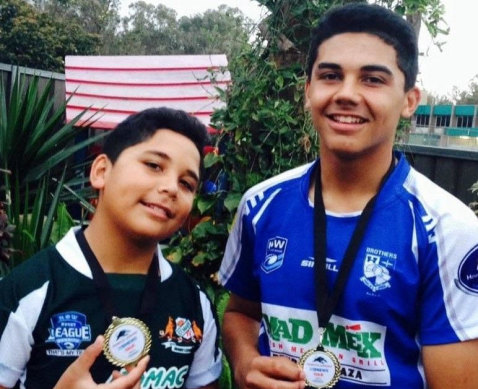A young Izack Tago posing up with big brother Jake.