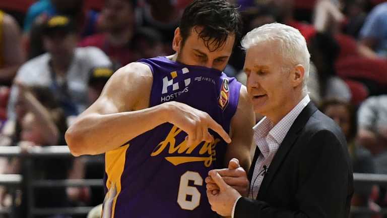 Great minds: Andrew Bogut talks tactics with coach Andrew Gaze during the clash with Illawarra on Friday night.