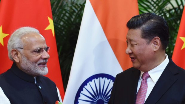 Indian Prime Minister Narendra Modi, left, shakes hands with Chinese President Xi Jinping in 2018. 