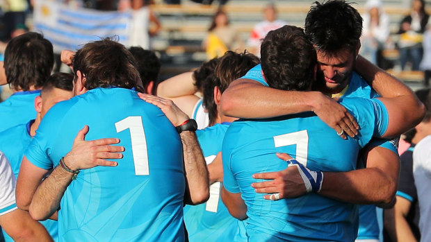 Jubilant Uruguay celebrate their 30-27 defeat of Fiji at the Rugby World Cup.