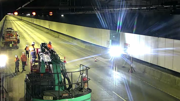 Workers inspect the westbound M4 tunnel, which is part of the WestConnex motorway. 