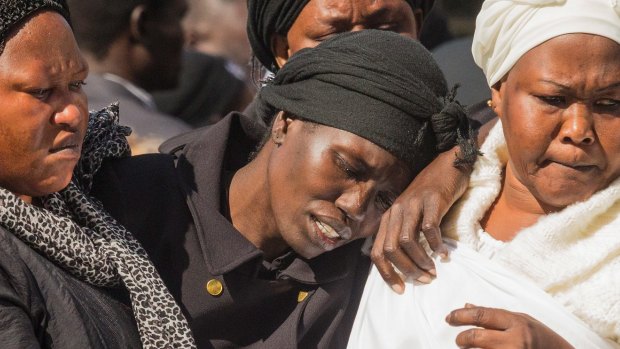 Akon Guode at her children's funeral in April 2015.