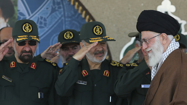 In this picture released by Iran, senior figures from the Revolutionary Guard salute Ayatollah Ali Khamenei.