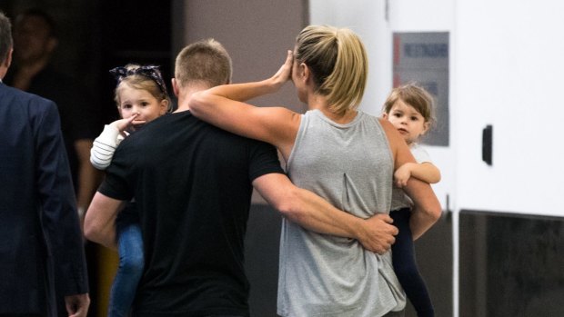 The Warners leave Sydney Airport after arriving back from South Africa in the wake of last year's ball-tampering scandal.