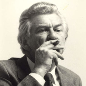 Bob Hawke smoking a cigar.