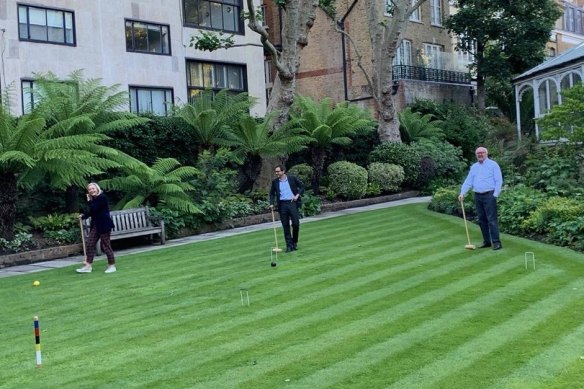 George Brandis, right, and Liz Truss, at left, playing croquet at the Australian High Commissioner’s Stoke Lodge.