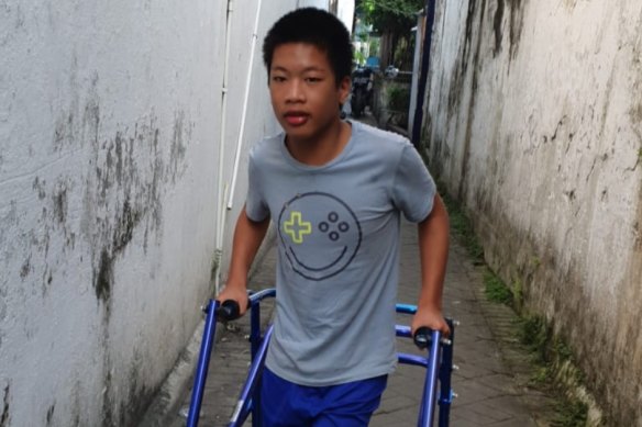 Jonathan Lumintang, 13, has cerebral palsy. 