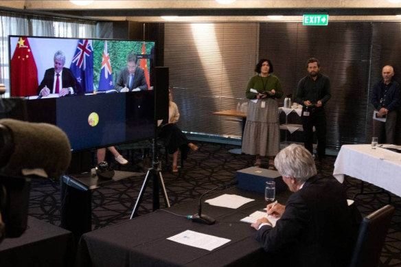 NZ Trade Minister Damien O’Connor and China’s Commerce Minister, Wang Wentao, sign an upgraded free-trade deal via video-link on Tuesday.