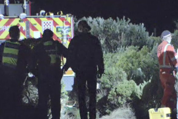 Police and SES crews retrieve the body of a man who fell to his death from a cliff near Torquay on Saturday morning.