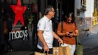 Shoppers in New York City. The US economy has so far defied policies which pundits said would crimp growth.