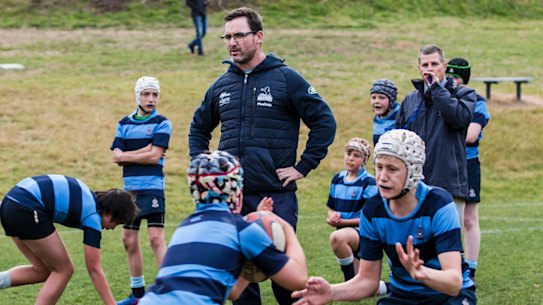 Brumbies head coach Dan Mackellar trains with the the Canberra Grammar under-14s team last year.
