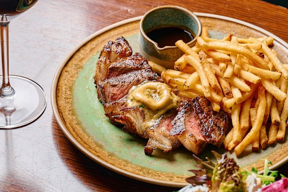 Steak with anchovy-and-confit-garlic butter and bottomless fries at Allegro.