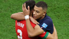 Achraf Hakimi of Morocco embraces Kylian Mbappe of France after the FIFA World Cup Qatar 2022 semi final match between France and Morocco.