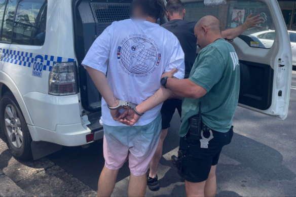 Police from Operation Amarok arrest a domestic violence suspect in Sydney.