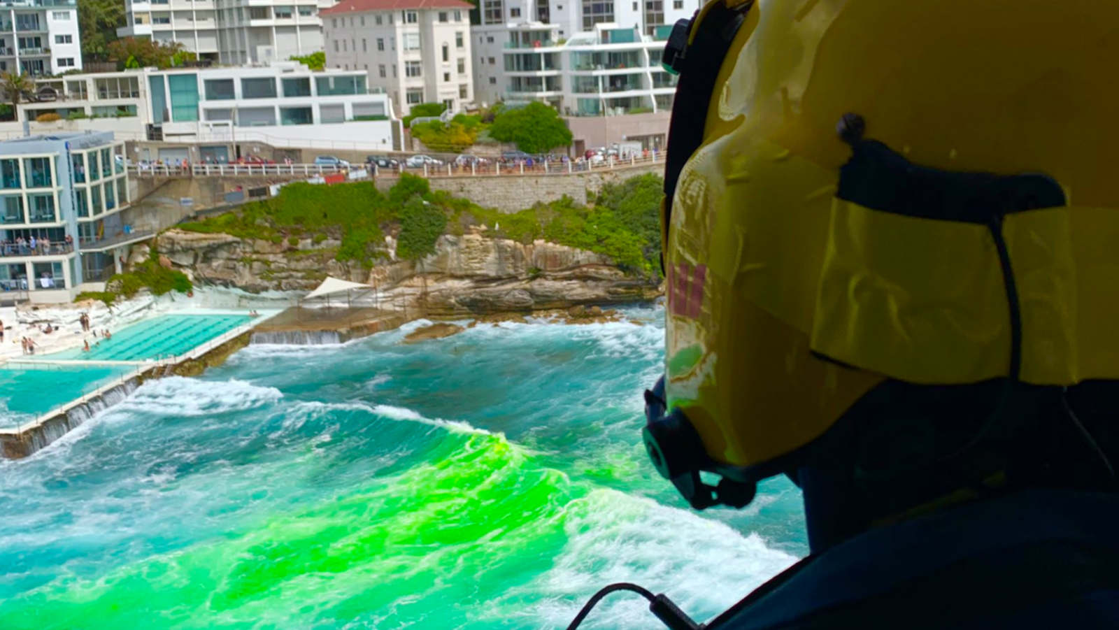 Sea marker dye is dropped into the water at the spot where a swimmer was reported missing. He was later found safe and well. 