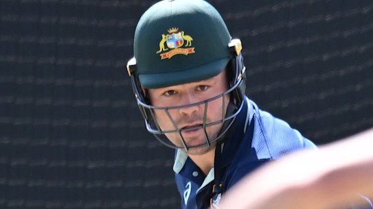 Wallabies player Harry Wilson (left) is seen batting against the bowling of Australian cricketer Marnus Labuschagne (right) during a group training session between the Wallabies and the Australian Cricket Team at the lan Healy Oval in Brisbane.
