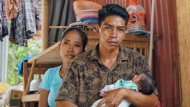 Hanan and his wife Reniatun with baby Akila, born since the earthquake.