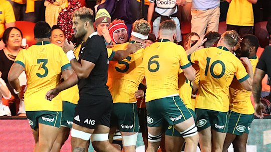 Red Bled redemption: The Wallabies celebrate in Brisbane.