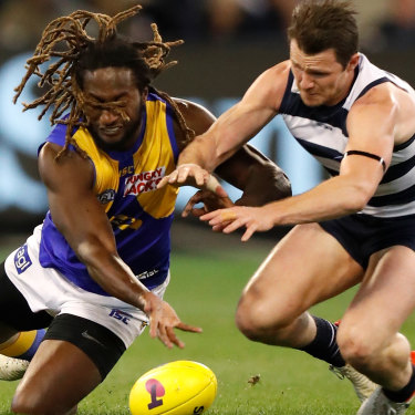 Nic Naitanui, left, shown here with Patrick Dangerfield, plays only 70 per cent of game time due to injury. Interchange reductions will force West Coast to rethink how they use their star ruckman.